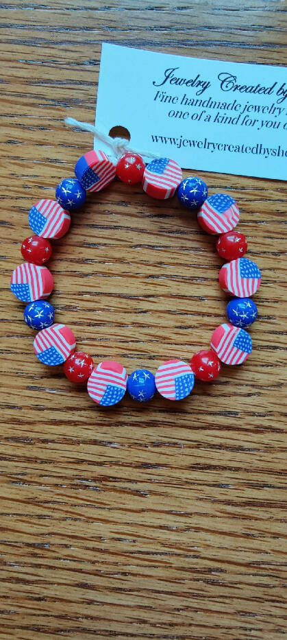 JB #44147 inch Sm. Stretch Acrylic red-blue star beads and Flag